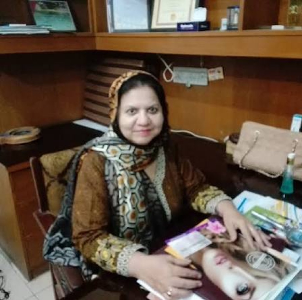 Dr. Nadeem Zehra at her clinic desk